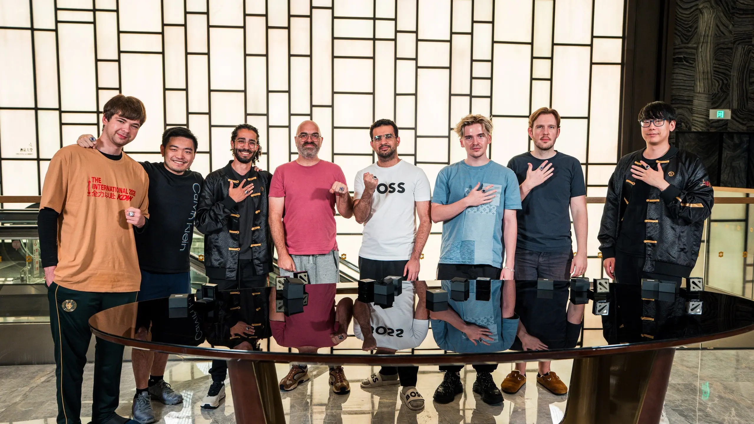 Photo of the Team Falcons roster in Shanghai with their TI 2025 championship rings